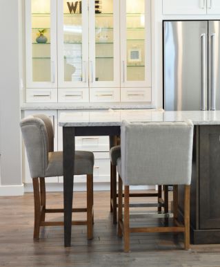 Clean and contemporary kitchen interior with white cabinets and minimalist decor.